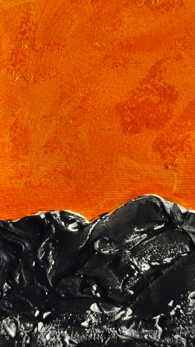 Dark sea under a hot sky