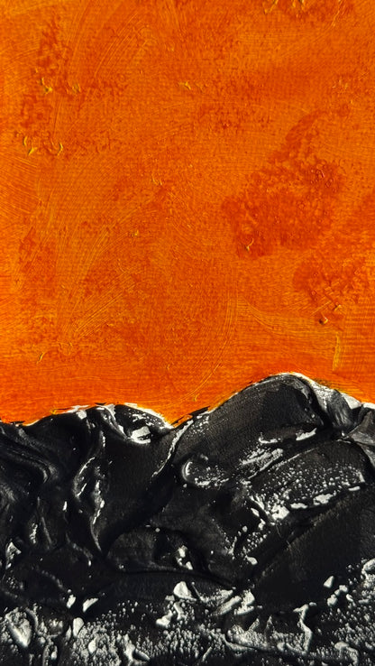 Dark sea under a hot sky