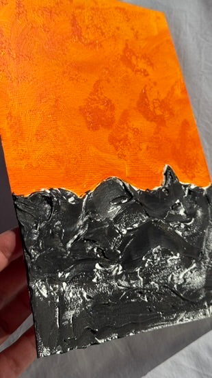 Dark sea under a hot sky